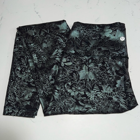 lululemon athletica Pants - Lululemon Wunder Train High-Rise Tight 25" *Foil
Logo Flourish Black Iridescent